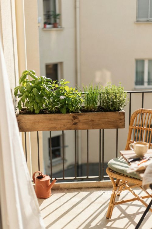 Very small balcony decor with rail mounted herb garden