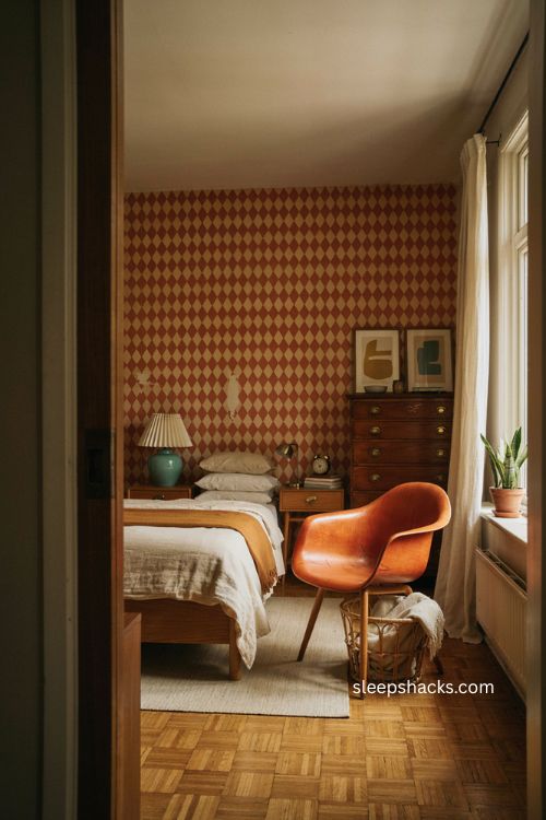 Vintage mid century bedroom with teal lamp and orange retro chair