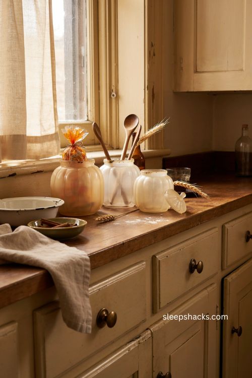 Vintage milk glass pumpkin jars for cozy farmhouse Halloween kitchen decor 