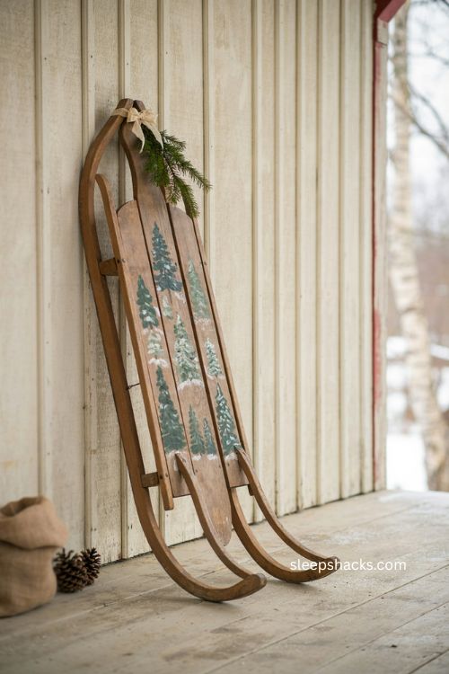 Vintage sled Christmas decor with hand painted evergreen trees and folk art 