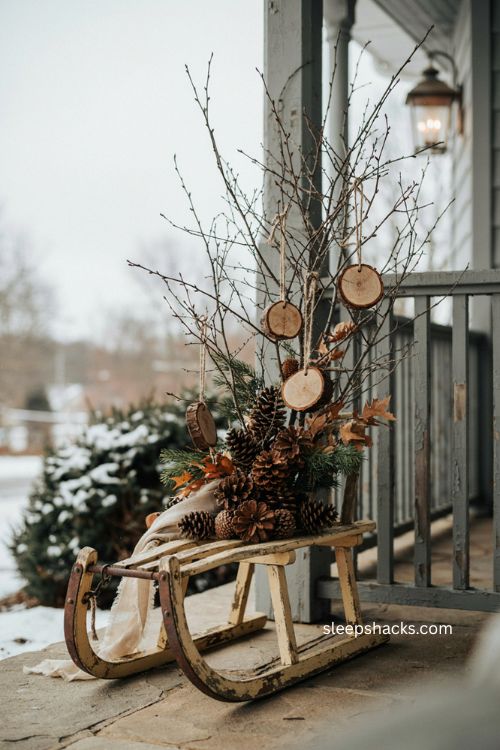 Vintage sled Christmas decor with natural branches and pinecones 