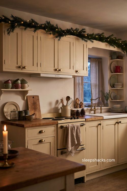 Warm white string lights above kitchen cabinets for cozy Christmas decor 