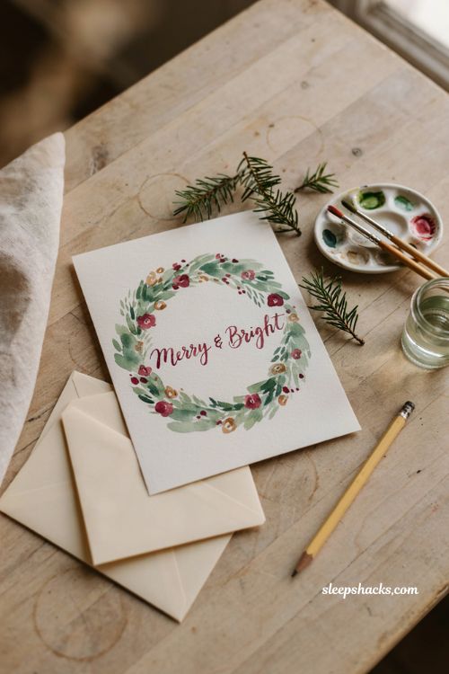 Watercolor wreath Christmas card ideas with handmade painted greenery
