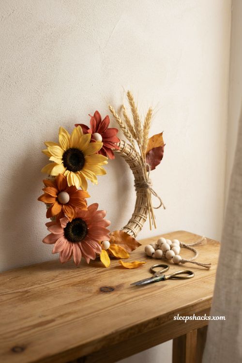 Wood bead and fabric sunflower decor for cozy Thanksgiving fall styling 