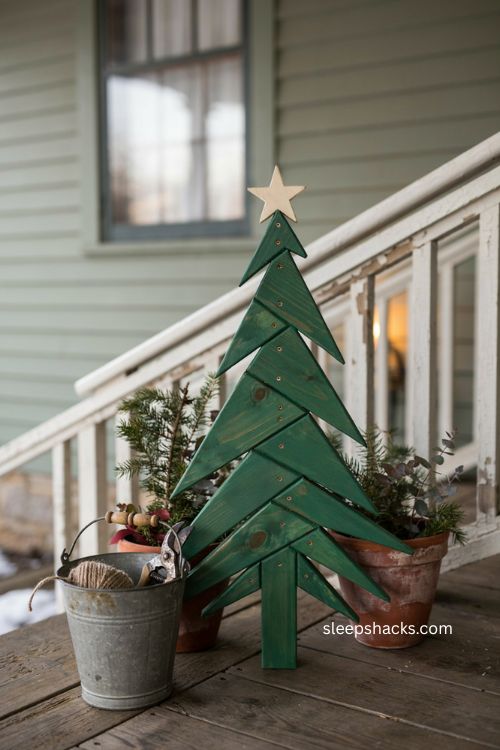 Wooden diy grinch christmas tree with rustic green paint angled star and pine boards