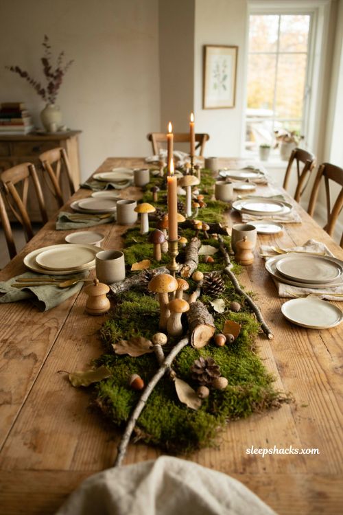 Woodland Thanksgiving centerpiece with moss mushrooms pinecones and natural forest decor 