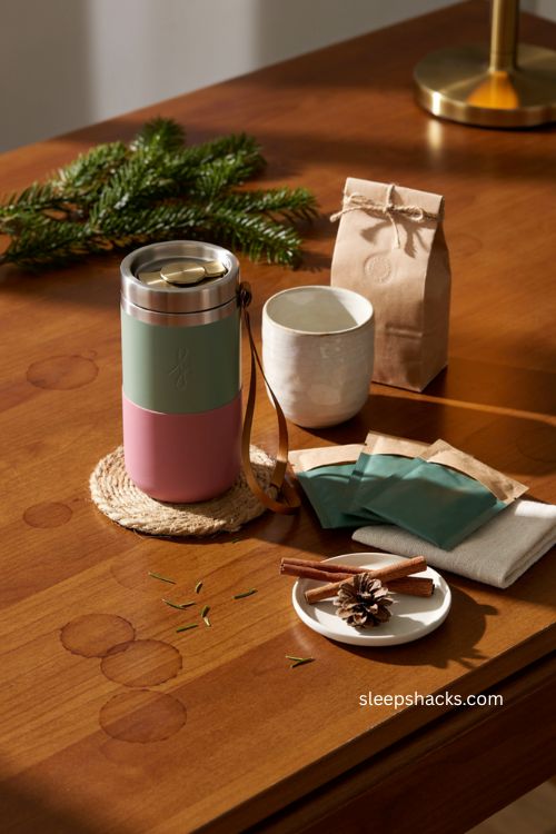 branded Christmas client drinkware gift with insulated tumbler coffee beans and cozy holiday details 