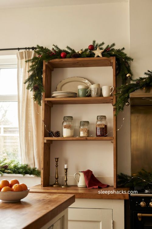 garland over open shelving in a cozy christmas kitchen 