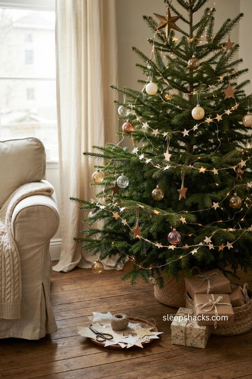 handmade paper star garland on a cozy christmas tree 