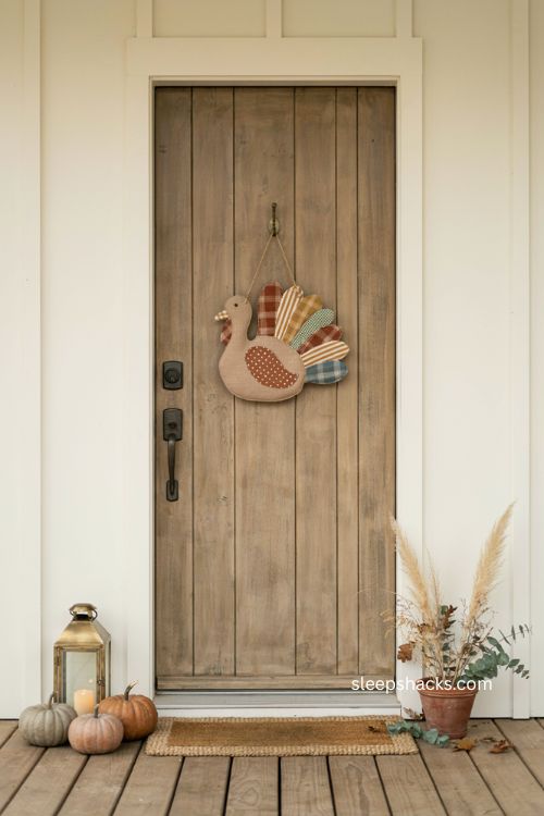 layered pumpkin stack door hanger with rustic farmhouse fall and Thanksgiving porch decor 