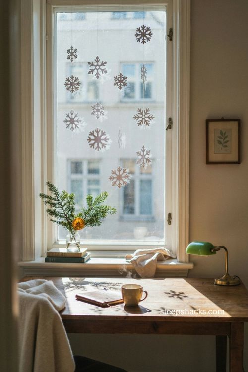 paper snowflake christmas office window decor with handmade white snowflakes 