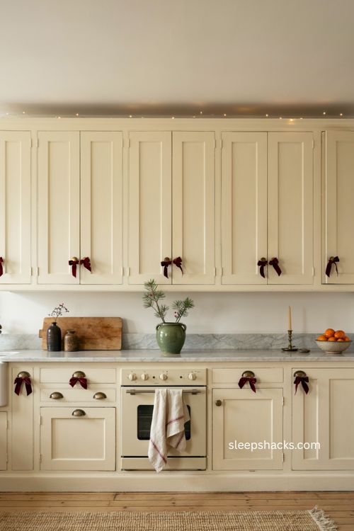 ribbon wrapped cabinet handles for cozy christmas kitchen decor 