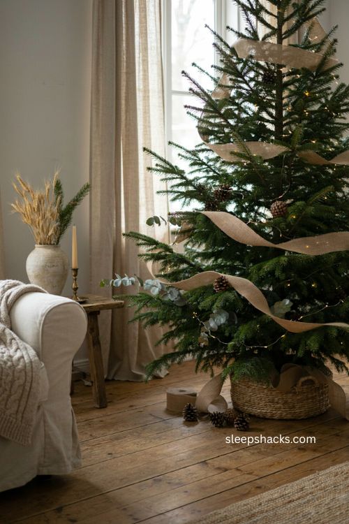 rustic burlap ribbon garland on a live christmas tree 