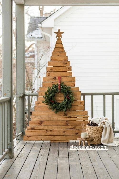 2x4 Christmas tree diy with evergreen wreath rustic farmhouse porch Christmas decor 