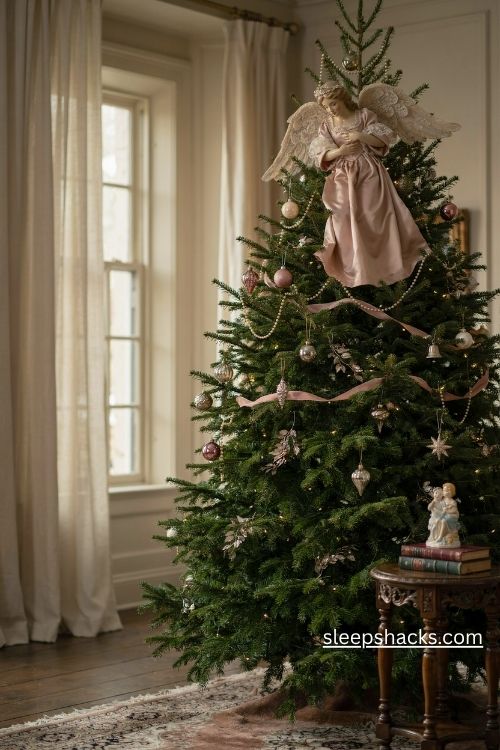 A pink angel tree topper