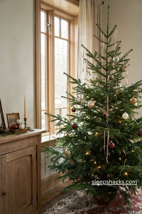 Antique metal lametta christmas tinsel shimmering like frozen rain on a nostalgic vintage tree