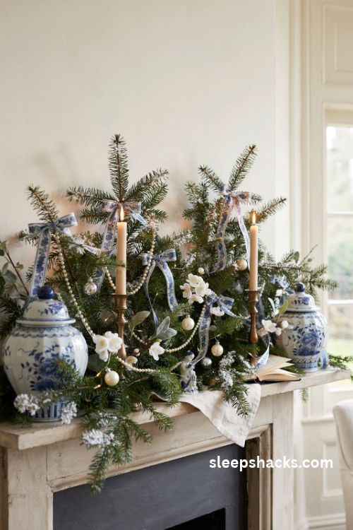 Blue and white Christmas garland with pearl strands silver ornaments and elegant chinoiserie ribbon on a mantel