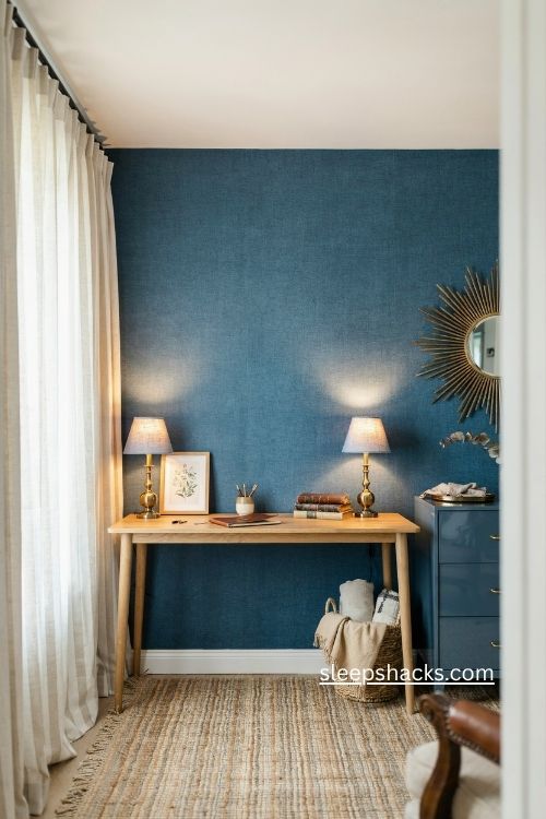Blue grasscloth home office with lacquered cabinet and vintage lamps