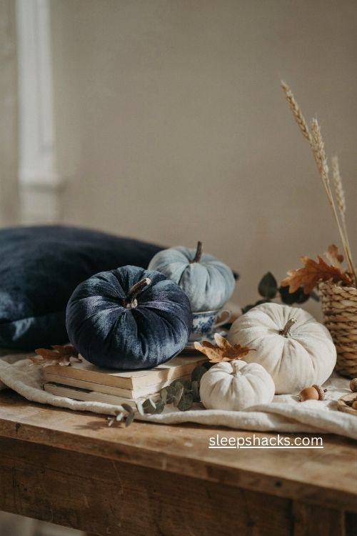 Blue velvet pumpkins with white pumpkins and cozy fall decor