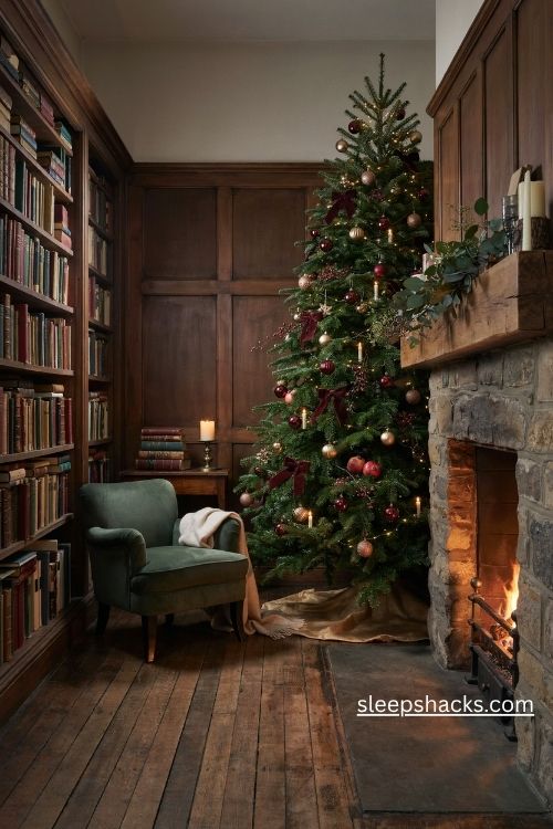 Burgundy and antique gold christmas tree with velvet bows and warm candlelit decor