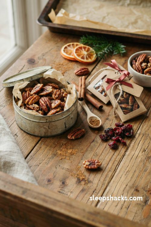 Candied cinnamon pecans in rustic christmas gift tins with homemade edible gift wrapping ideas