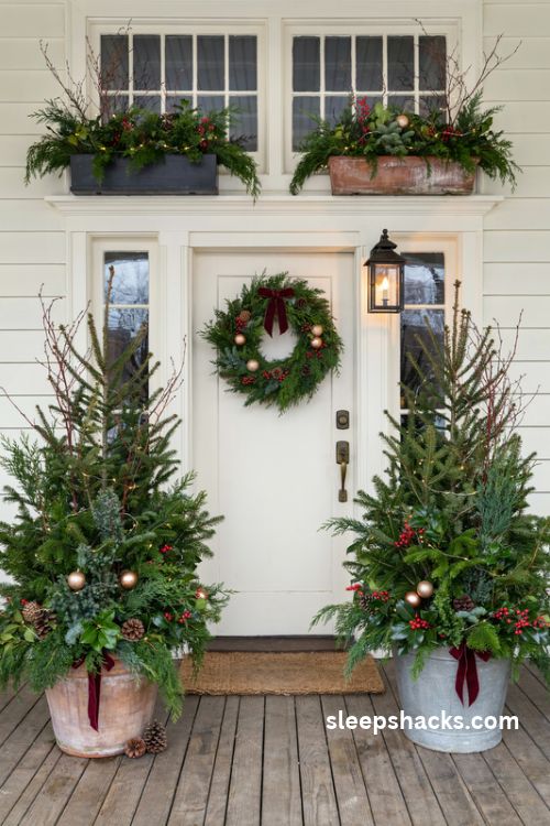 Christmas porch planter ideas with evergreen branches red dogwood twigs and festive window boxes