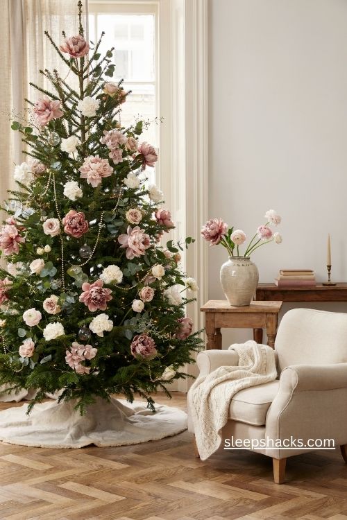 Christmas tree with blush pink peonies ivory roses eucalyptus and delicate pearl ornaments