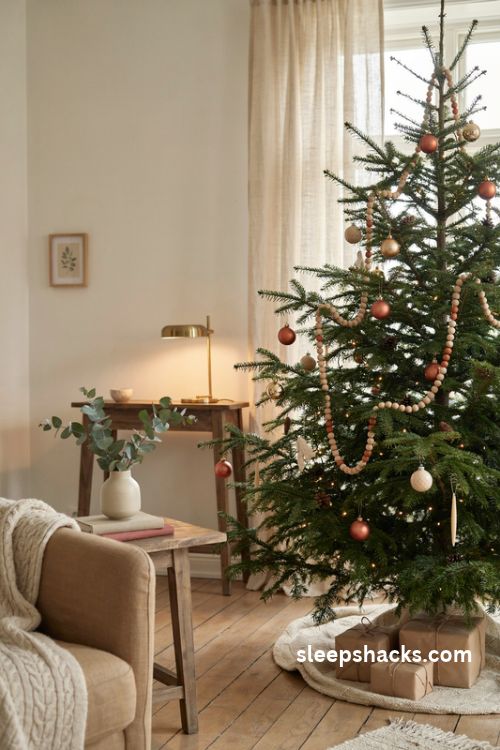 Christmas tree with wooden bead garland in oak walnut and burnt orange tones
