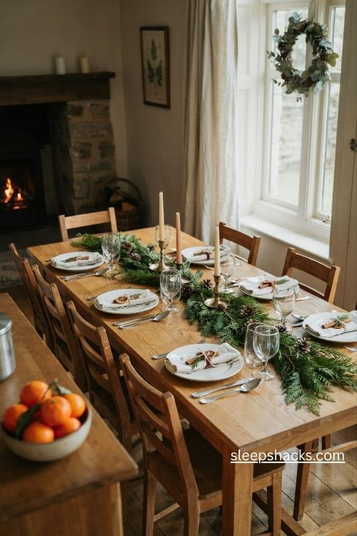 Cinnamon stick napkin wraps with twine greenery and dried orange for christmas dinner