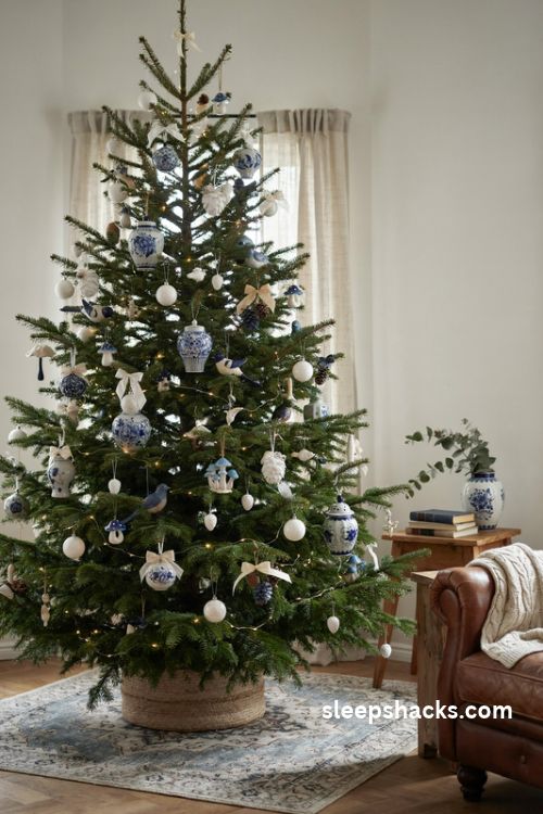 Classic blue and white Christmas tree with ginger jar ornaments and elegant cream bows