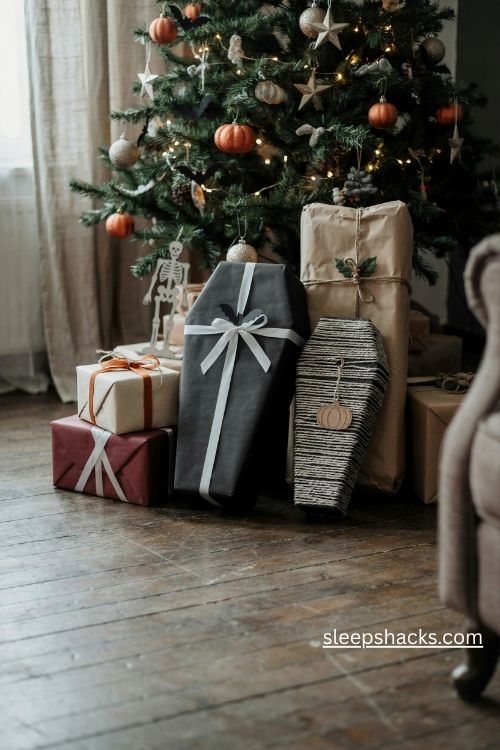 Coffin gift boxes wrapped in black paper with striped ribbon skeleton tags and gothic christmas presents