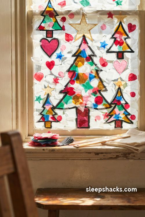 Contact paper stained glass Christmas window with colorful tissue paper stars trees and hearts
