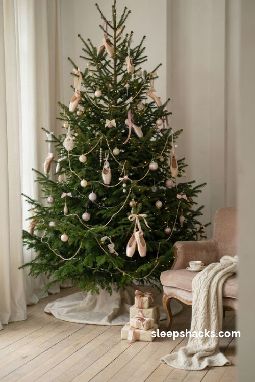 Coquette Christmas tree with tiny blush pink ballet slipper ornaments and satin ribbon bows