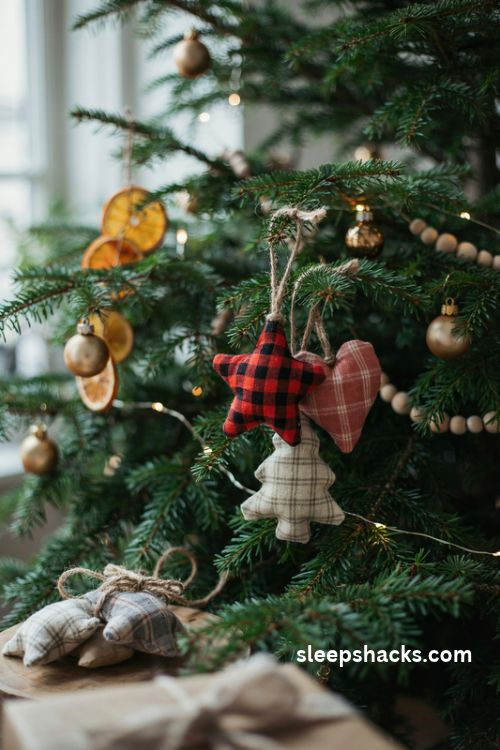 DIY plaid fabric Christmas ornaments shaped like stars hearts and trees with rustic twine hangers
