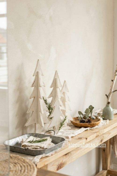 Distressed white wood christmas trees with cozy farmhouse console decor 