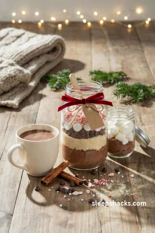 Diy hot chocolate kit in a jar with marshmallows peppermint and rustic christmas gift wrapping