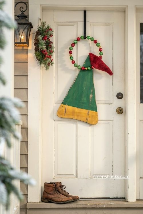 Elf inspired Christmas door hanger with green yellow red and glitter accents