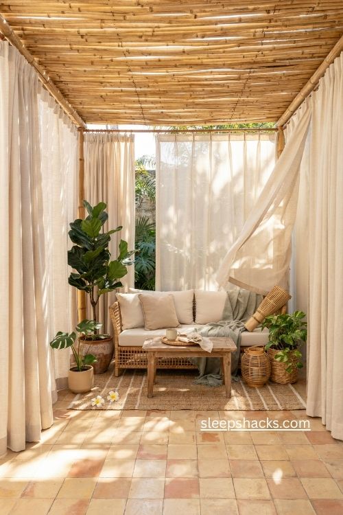 Enclosed patio ideas with outdoor curtains bamboo shade and cozy seating