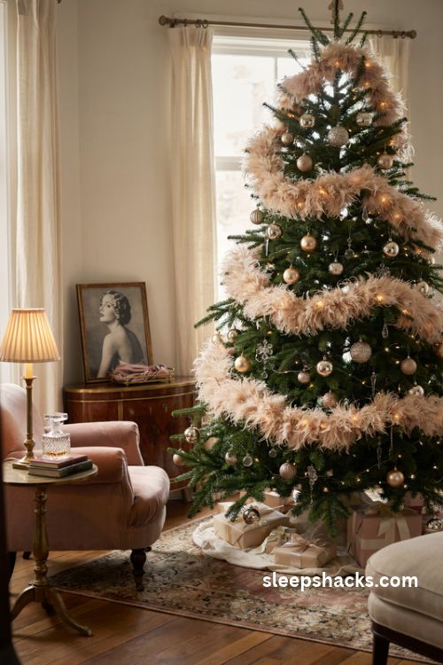 Feather boa christmas tree garland with champagne gold ornaments and vintage hollywood glamour