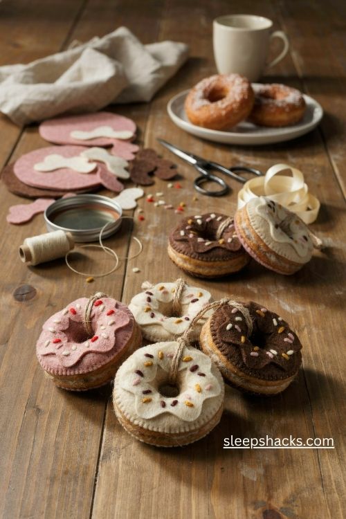 Felt donut christmas ornaments in strawberry vanilla and chocolate icing with colorful handmade sprinkles