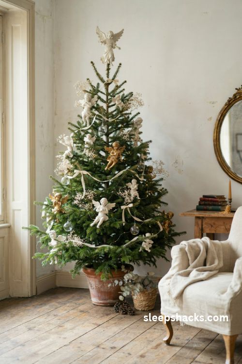 French country Christmas tree with antique cherub and angel ornaments ivory ribbon gilded details and warm lights