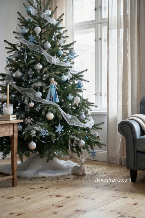 Frozen Elsa ice blue and silver Christmas tree with snowy ornaments and magical winter decor 