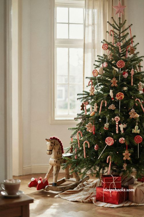 Gingerbread christmas tree decorated with oversized candy cane and lollipop picks in a cozy living room