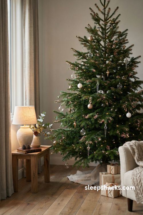 Glitter dipped christmas tree branch tips with frosted sparkle and elegant glass ornaments