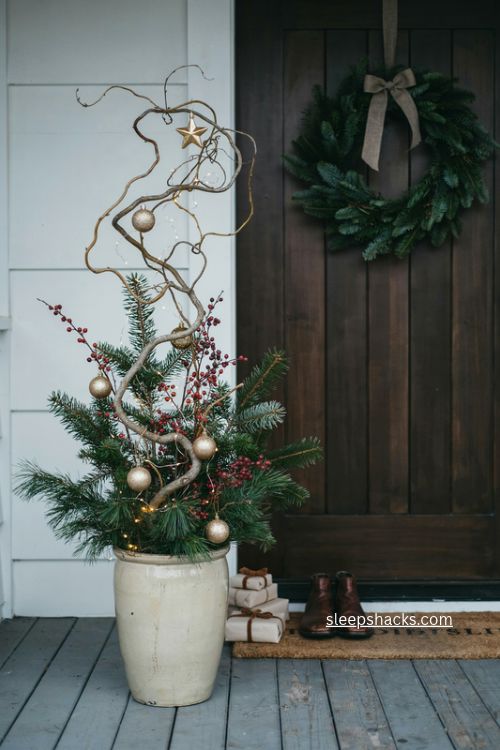 Gold and gilt christmas planter with curly willow berries and star