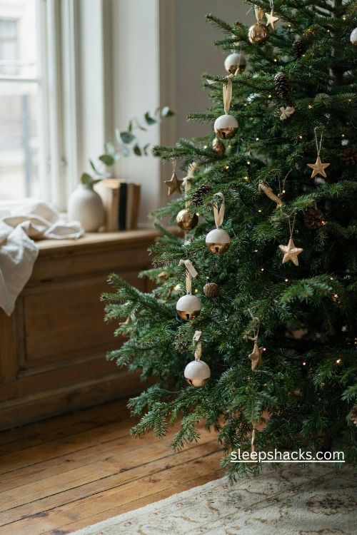 Gold dipped white ceramic bell christmas ornaments with cream velvet ribbons
