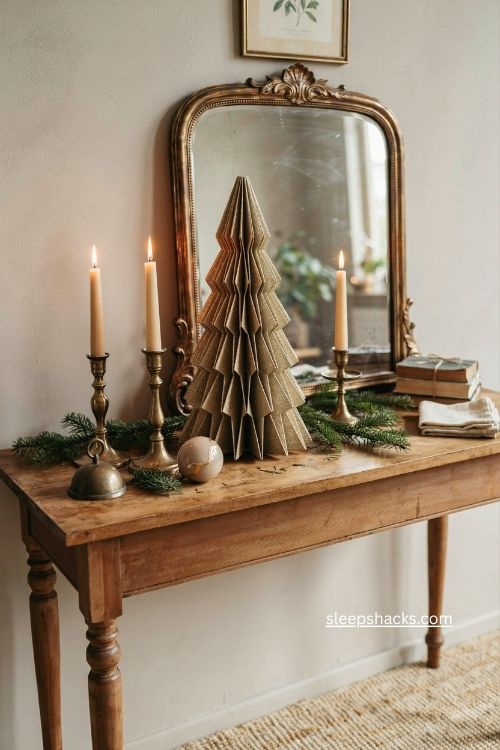 Gold glitter spray magazine tree beside a vintage christmas mirror 