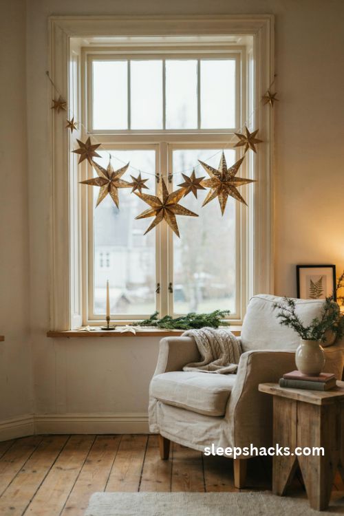 Gold star window garland with floating paper stars and cozy christmas window decor