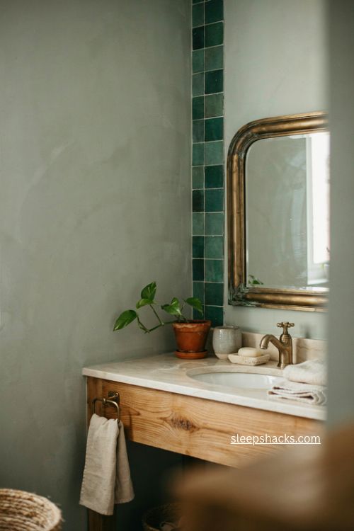Green bathroom ideas with sage walls natural wood vanity brass and marble
