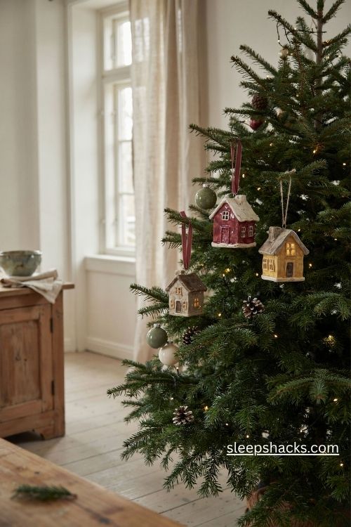 Hand painted ceramic snowy village christmas ornaments with tiny glowing windows